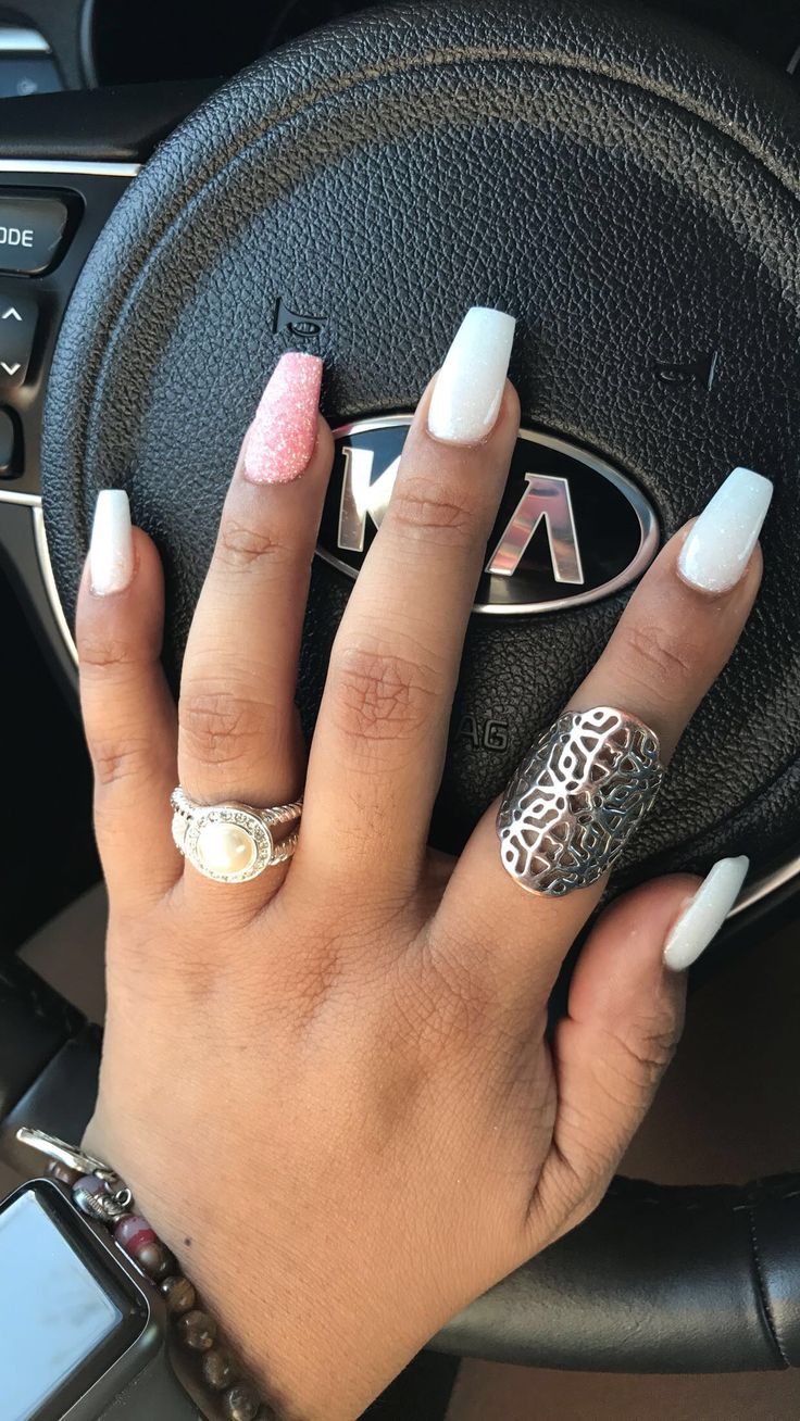 Sophisticated Nail Design: Glossy White with Textured Pink Accents and Sparkly Gradient.