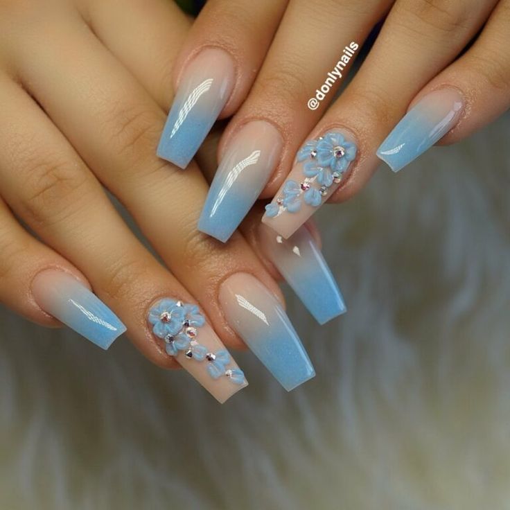 Elegant Ombre Nail Design with Soft Blue and Beige Gradient, Adorned with Intricate Floral Accents.