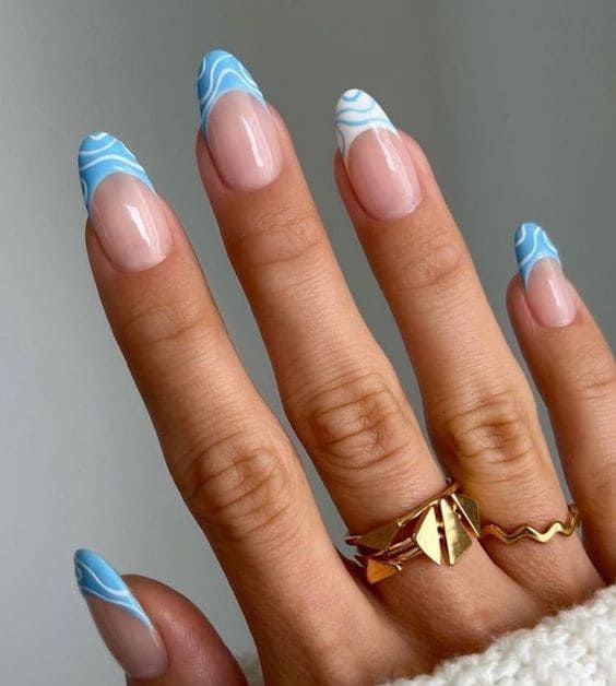 Chic Light Blue Swirl Nail Design with Nude Base and Gold Accents