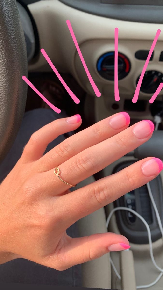 Vibrant Pink-Tipped French Manicure: A Chic and Playful Summer Look with Gold Accents.