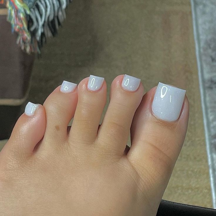 Chic Minimalist White Toenails for a Fresh Summer Look.