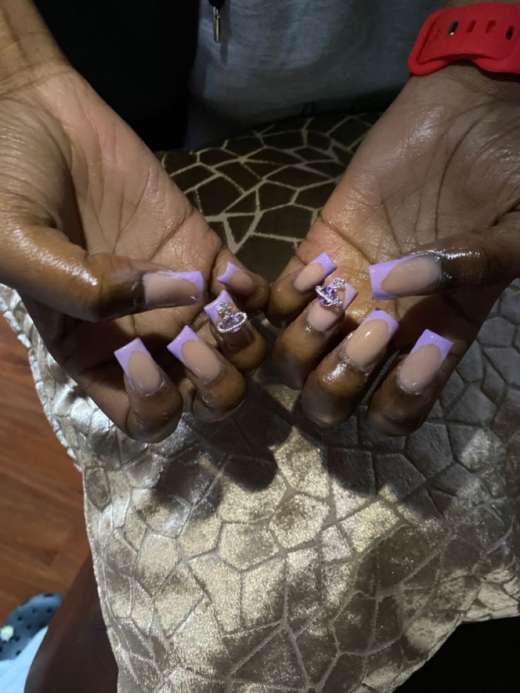 Chic Nail Design: Elegant Soft Pink Base with Vibrant Lilac Tips and Rhinestone Accents