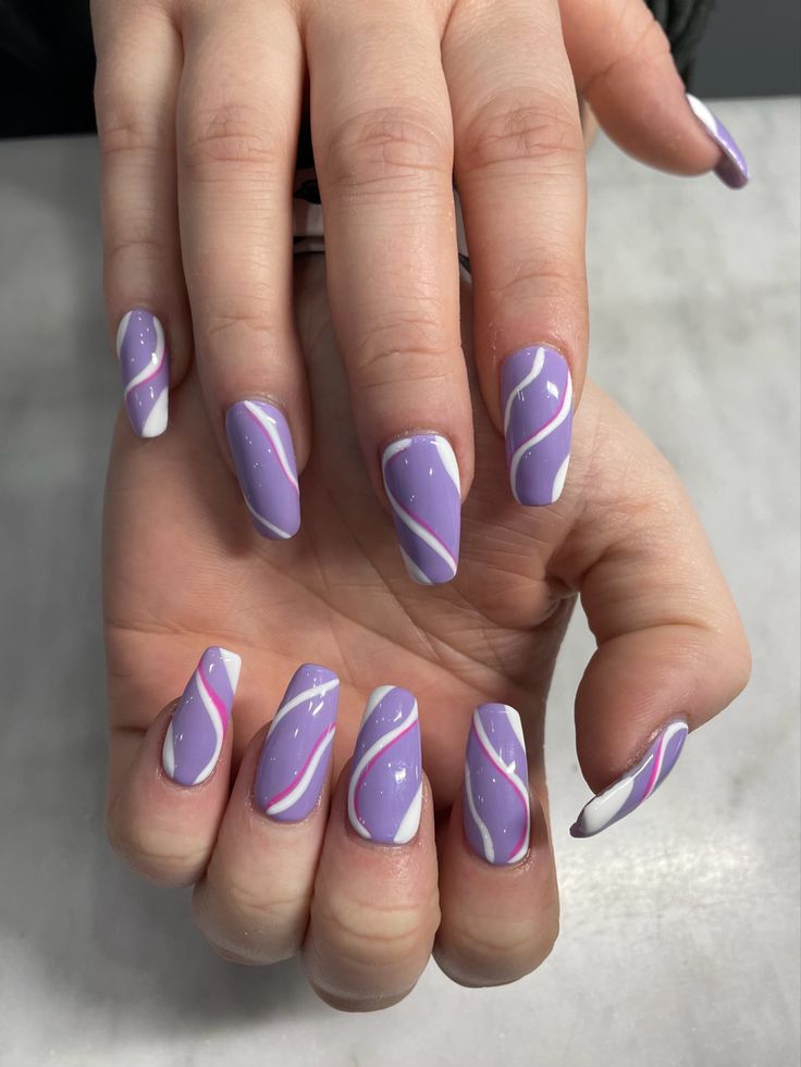 Chic Lavender Nail Design with Flowing White and Pink Accents.