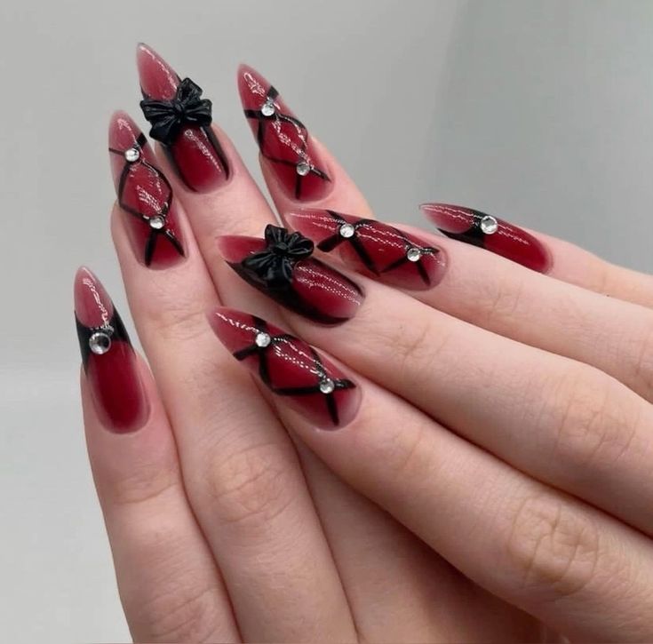 Chic Red and Black Geometric Nail Design with Bows and Rhinestones