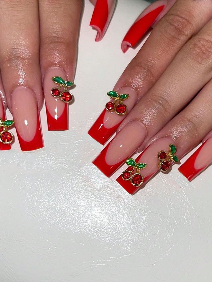 Bold Red-Tipped Nail Design with Cherry and Leaf Accents for a Playful Summer Vibe.