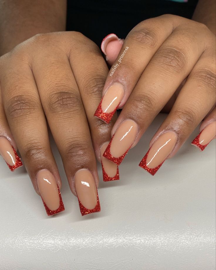 Chic Acrylic Nails: Elegant Nude Base with Bold Red Glitter Tips