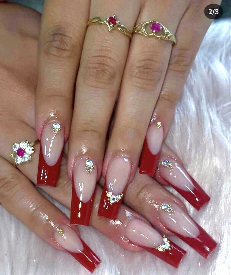 Luxurious Elegant Nail Design: Deep Red Tips on a Nude Base with Rhinestones and Gold Accents