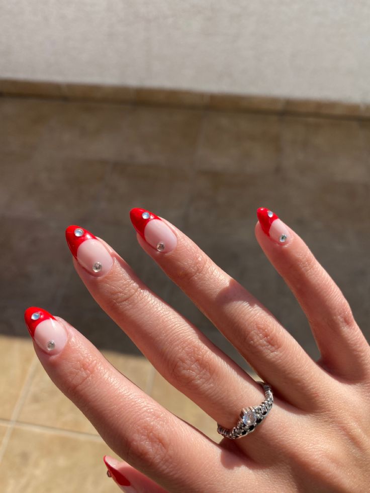 Elegant Red and Nude Pointed Tip Nail Design with Gem Accents