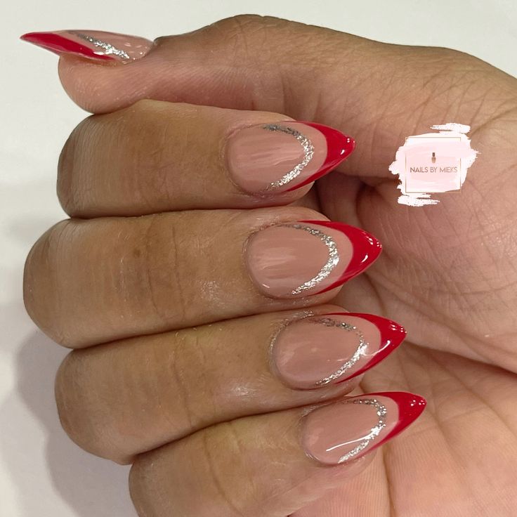 Chic Red French Tip Nail Design with Silver Accents on a Smooth Nude Base