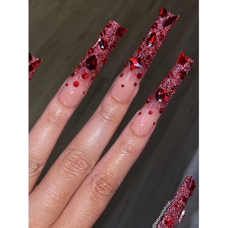 Elegant Red and Glittery Nail Design with Rhinestones for Bold Statements.