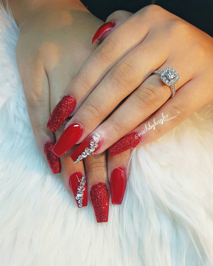 Elegant Red Nail Design with Glitter and Glossy Accents for a Stylish Look.