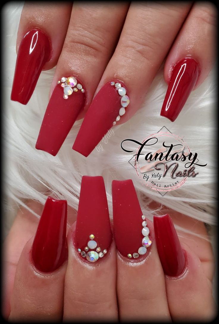 Sophisticated Matte Red Nails with Sparkling Embellishments for Special Occasions.