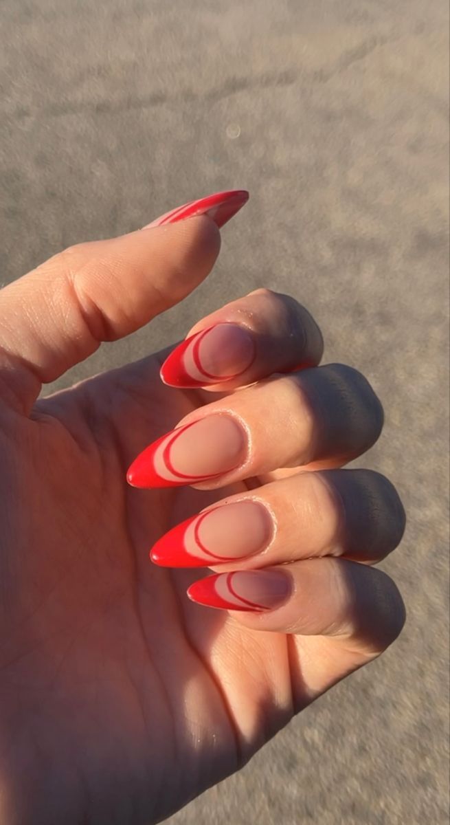 Chic Almond-Shaped Nail Design with Striking Red Ombre and Sophisticated Matte-Gloss Contrast.