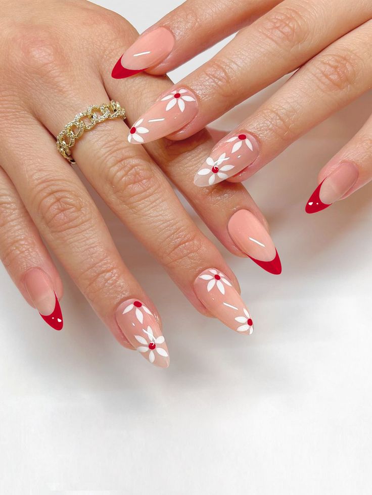 Sophisticated Floral Nail Art with Nude and Red Accents