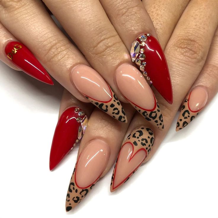 Chic Stiletto Nail Design: Bold Red and Nude with Leopard Print and Rhinestones.