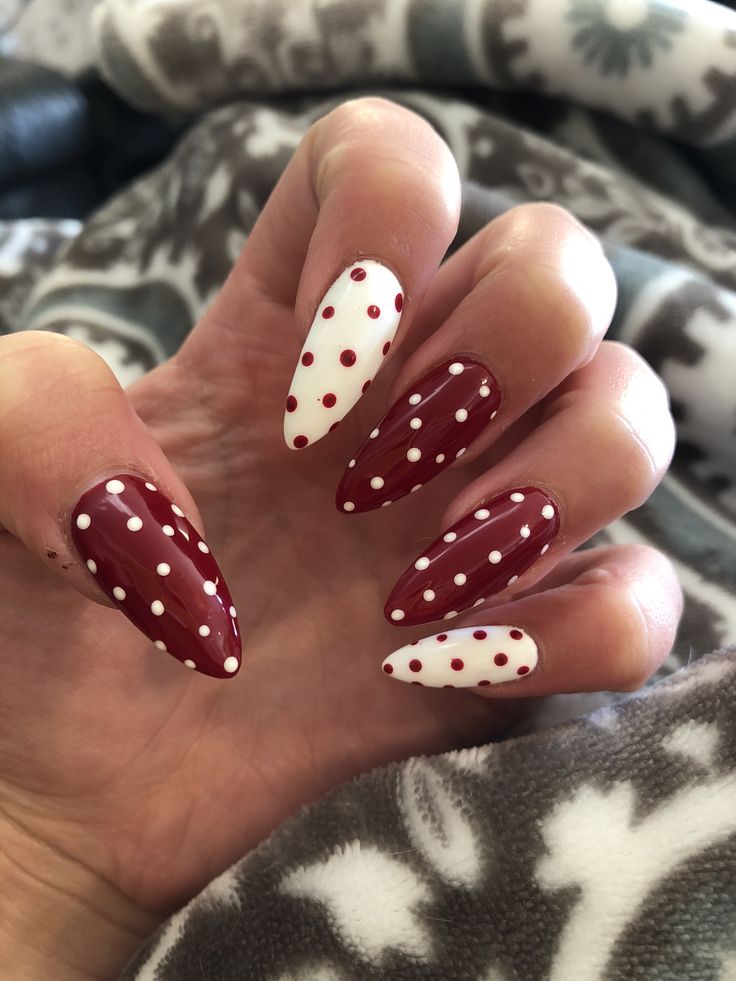 Chic Red and White Polka Dot Almond-Shaped Nail Design.