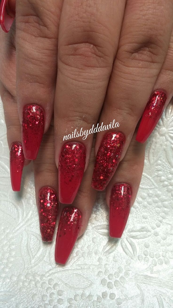 Chic Bold Red Glossy Nails with Sparkling Glitter for a Glamorous Look.