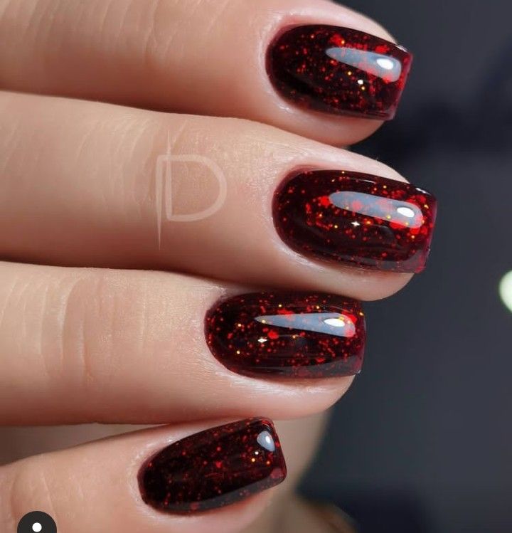 Elegant Sparkling Red Nail Design with Glossy Finish and Vibrant Glitter.