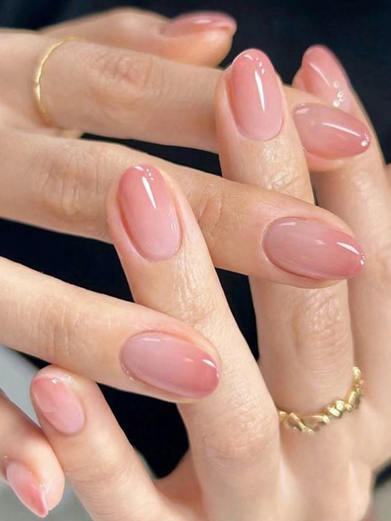 Timeless Elegant Nude Nail Design with Soft Gradient and Minimalist Gold Accessories.