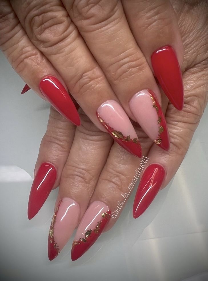 Chic Almond-Shaped Nail Design with Vibrant Red and Soft Pink Accents