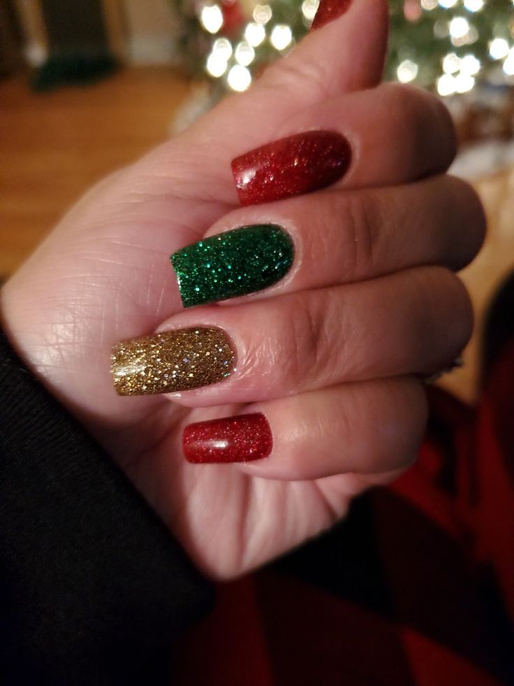 Vibrant Festive Nail Design: Striking Red, Green, and Gold Glitter for Holiday Celebrations.