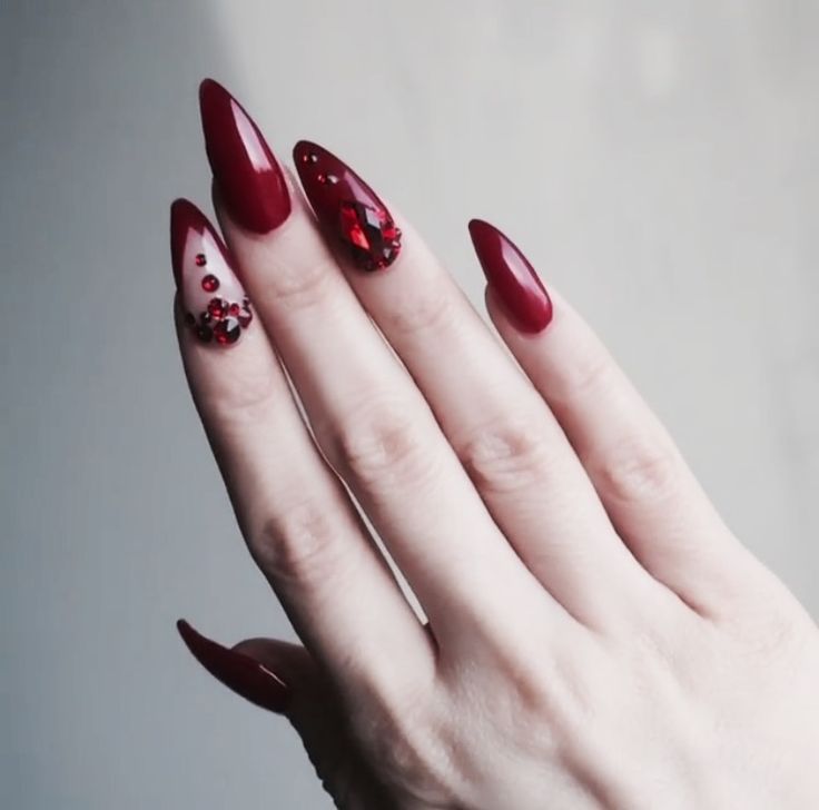 Dramatic Elegant Red Nail Design with Glossy-Matte Finish and Glamorous Embellishments.