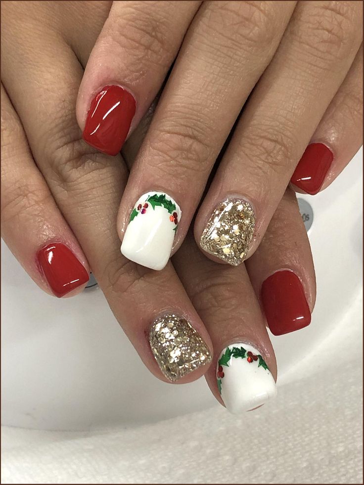 Cheerful Red and Gold Festive Nail Design with Holly Accents for Holiday Celebrations.