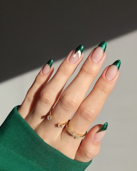 Striking Green French Tip Manicure with Shimmer on Nude Base for Sophisticated Elegance.