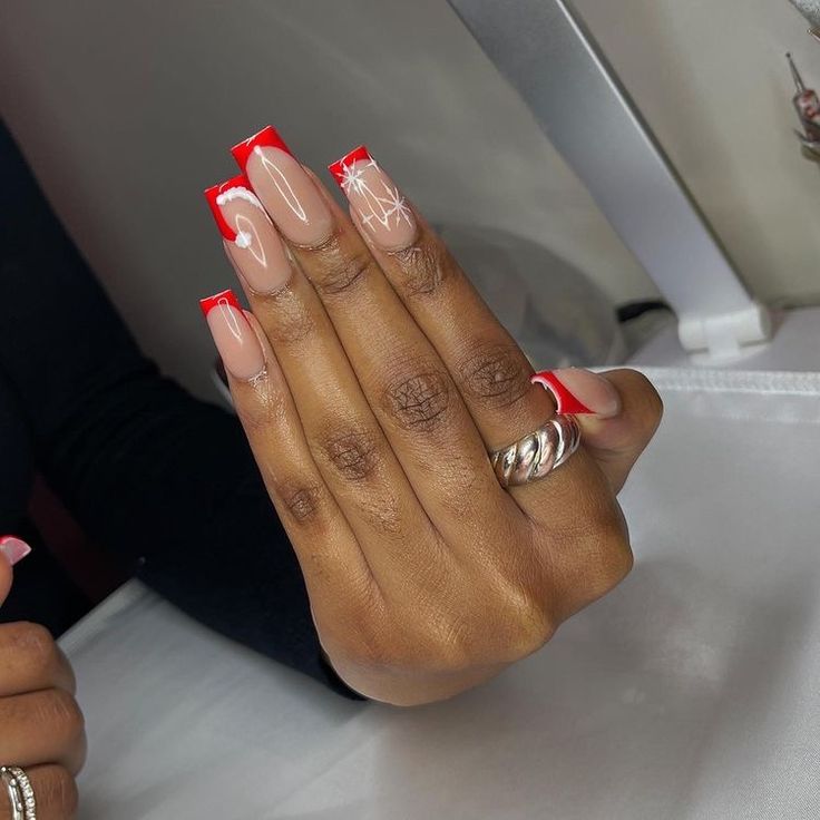 Chic Red-Tipped Nude Nails Enhanced with Elegant White Abstract Designs.