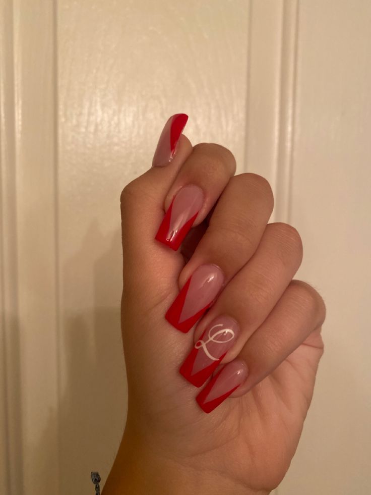 Chic Red and Nude French Tip Nail Design with Elegant Accent.