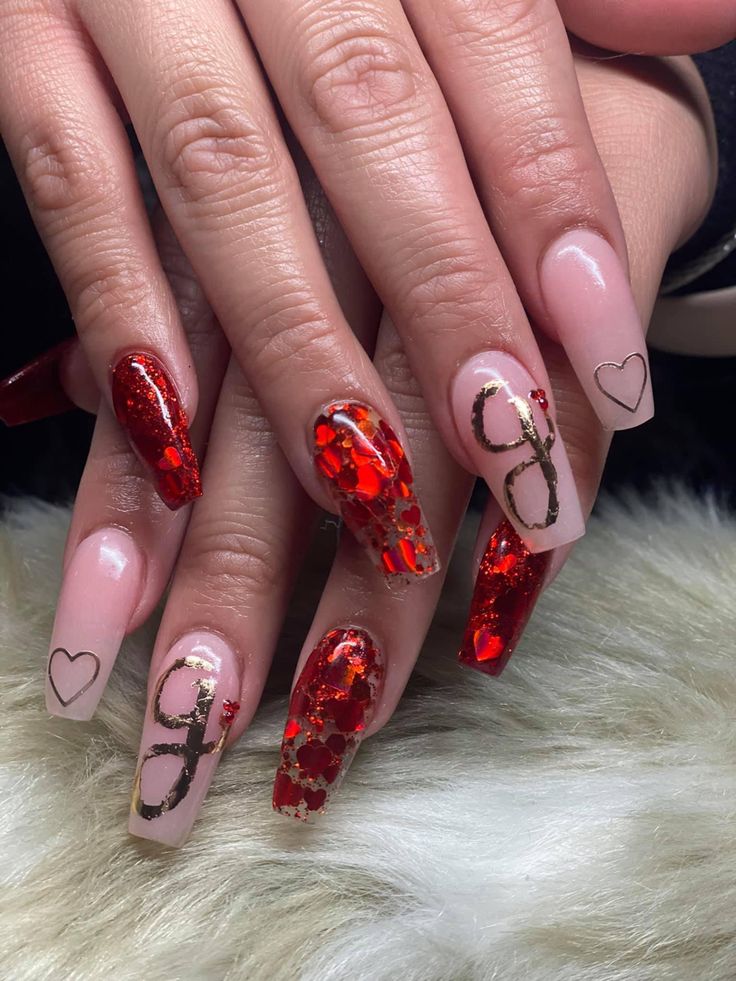 Chic Nail Design: Bold Reds and Soft Nudes with Glitter and Heart Details