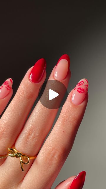 Chic Bold Red and Nude Nail Design with Patterns and Gold Accents.