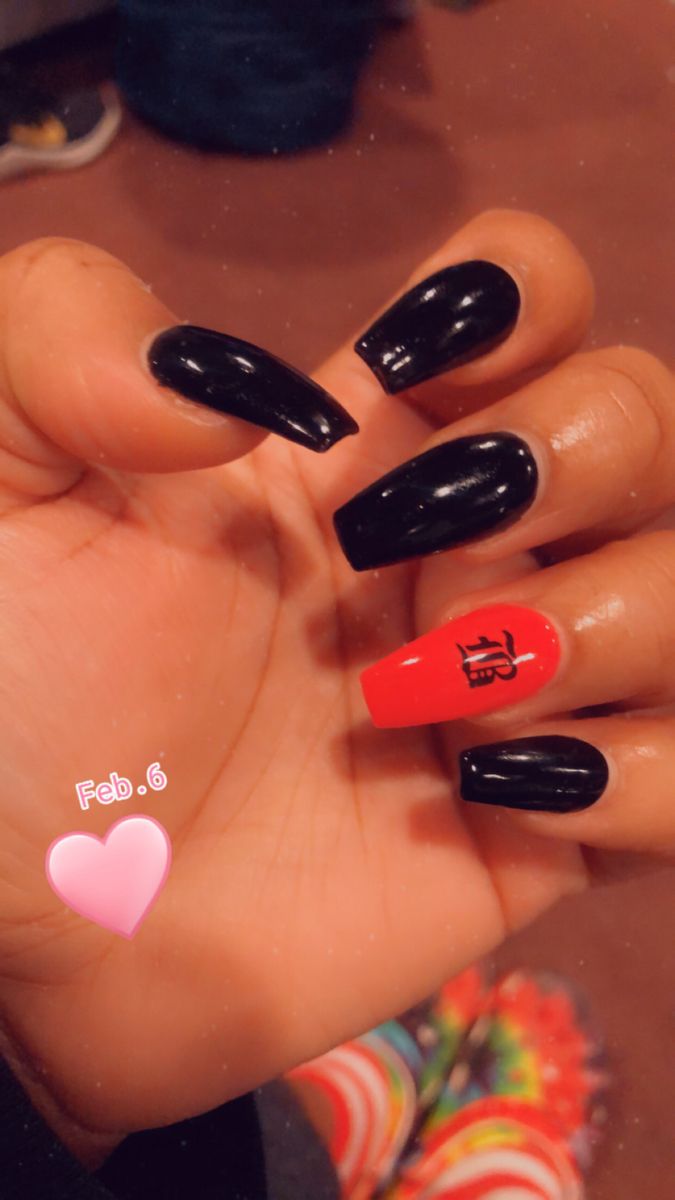 Chic Black and Bold Red Nail Design with Graphic Accents