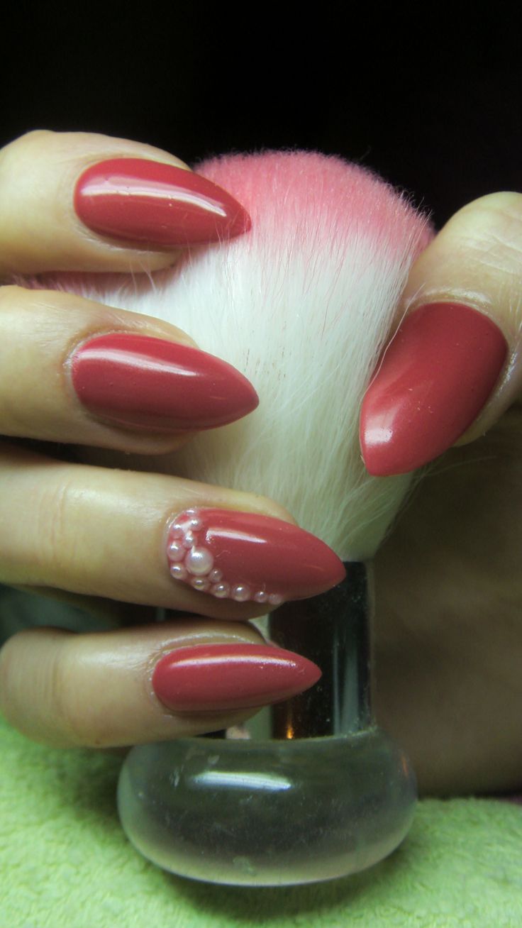 Chic Coral Almond Nails with Pearl Accent: A Stylish Harmony of Beauty and Creativity