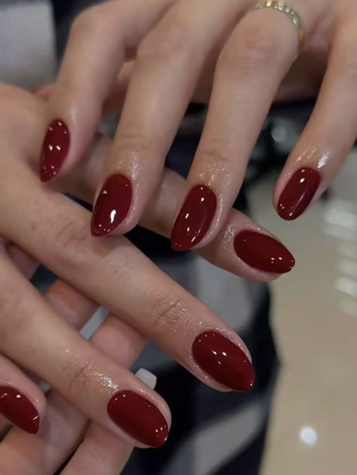 Sophisticated Deep Red Almond-Shaped Manicure: A Timeless and Modern Elegance.