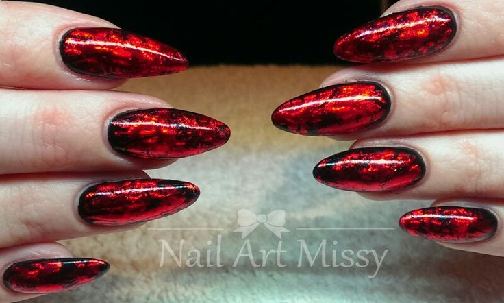 Elegant Red Metallic Nails: A Glamorous Statement with a Shimmering Finish.