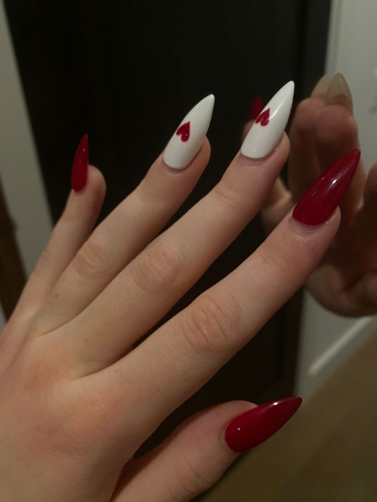 Romantic Almond-Shaped Nail Design with Bold Red and Crisp White Contrast