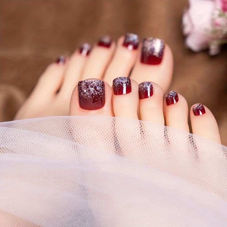 Sophisticated Deep Burgundy Glitter Gradient Pedicure with Elegant Soft Draping.