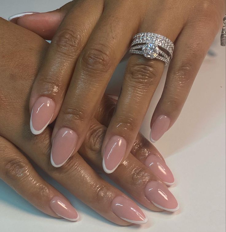 Chic Almond-Shaped Nails with Nude Base and Classic French Tips for Timeless Elegance.