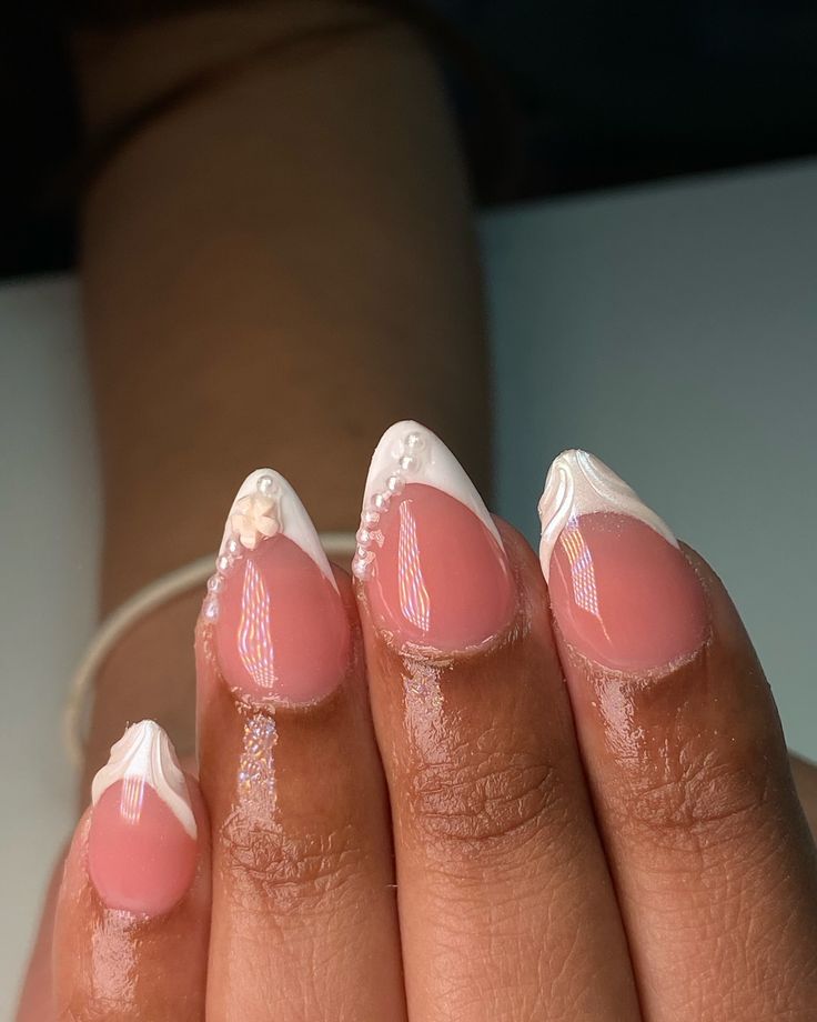 Elegant Soft Pink Nail Design with White Embellishments and Glossy Finish.