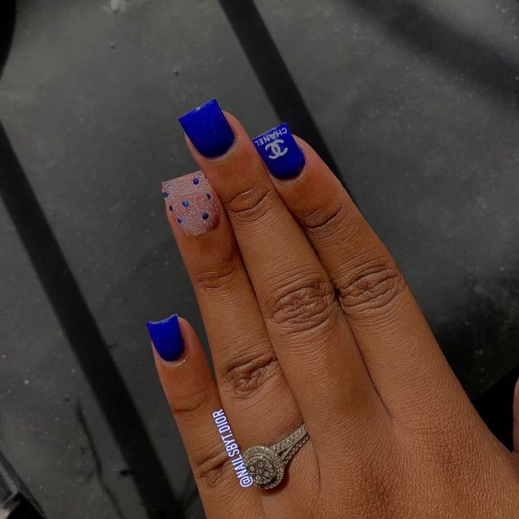 Chic Blue Nail Design with Elegant Rhinestone Accents and Bold Color Scheme