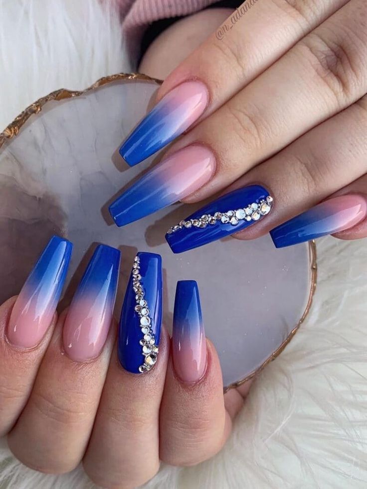 Striking Blue and Nude Gradient Nail Design Adorned with Sparkling Rhinestones.