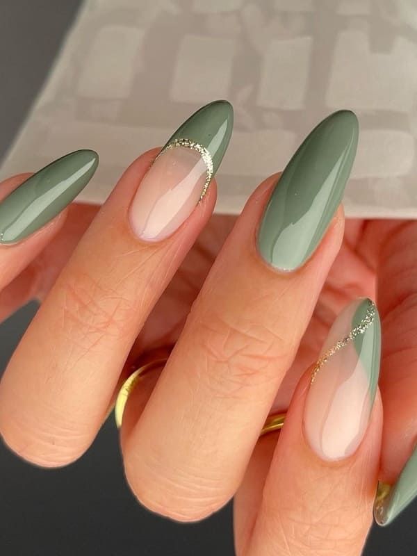 Sophisticated Chic: Elegant Soft Green Nail Design with Glossy Finish and Sparkling Accents.