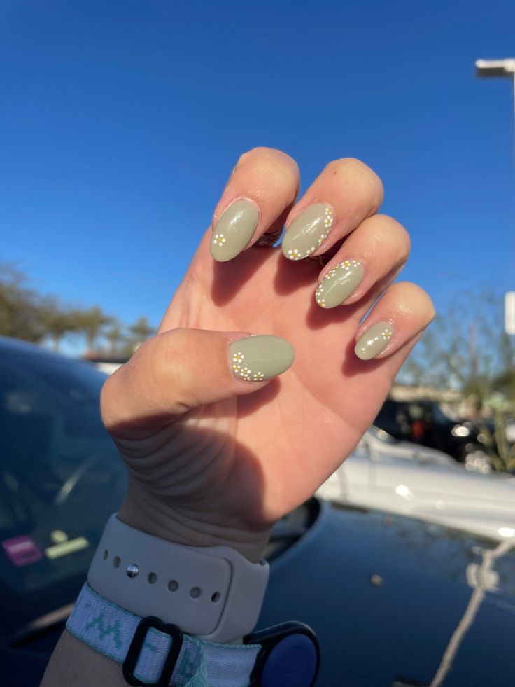 Chic Elegant Green Matte Almond Nails with Dotted Accents for Understated Sophistication