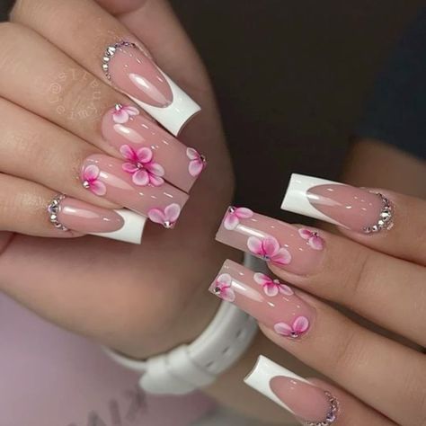 Elegant Pink Blossom Floral Nail Design with Sophisticated White Tips and Rhinestone Accents.