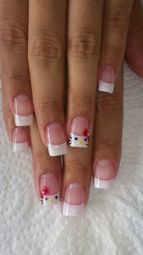 Playful French Manicure with Adorable Hello Kitty Accents.