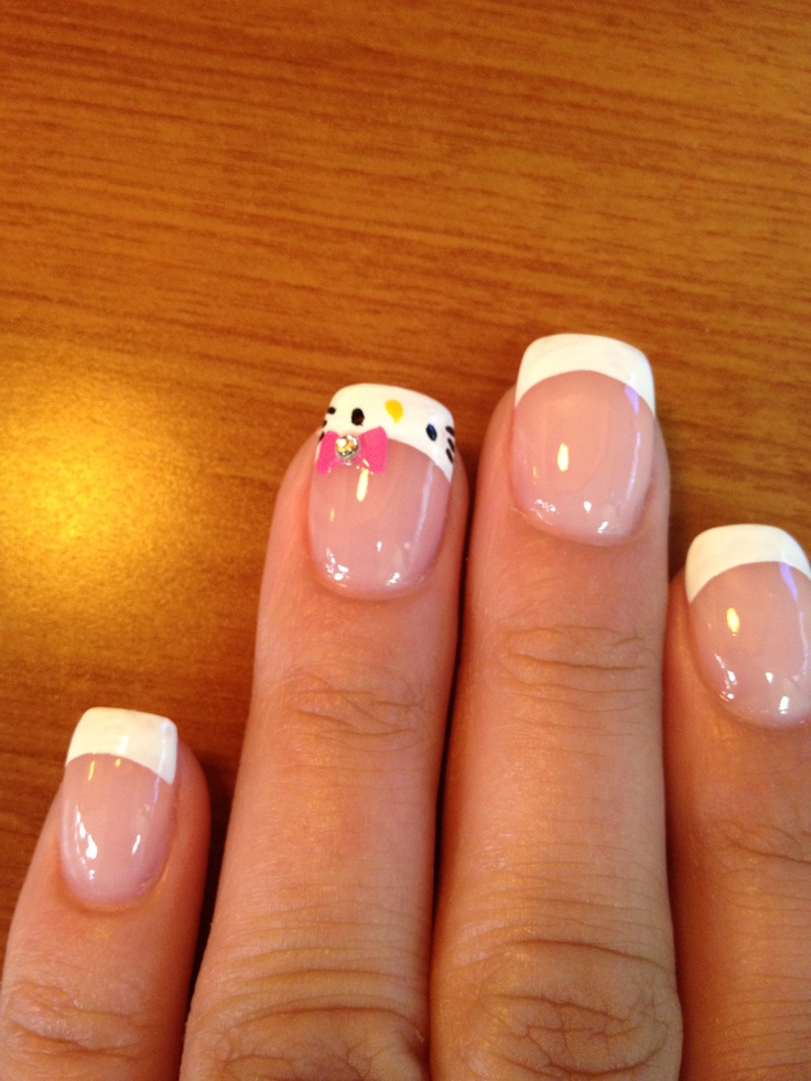 Charming French Manicure with Playful Character Accents for a Whimsical Touch.