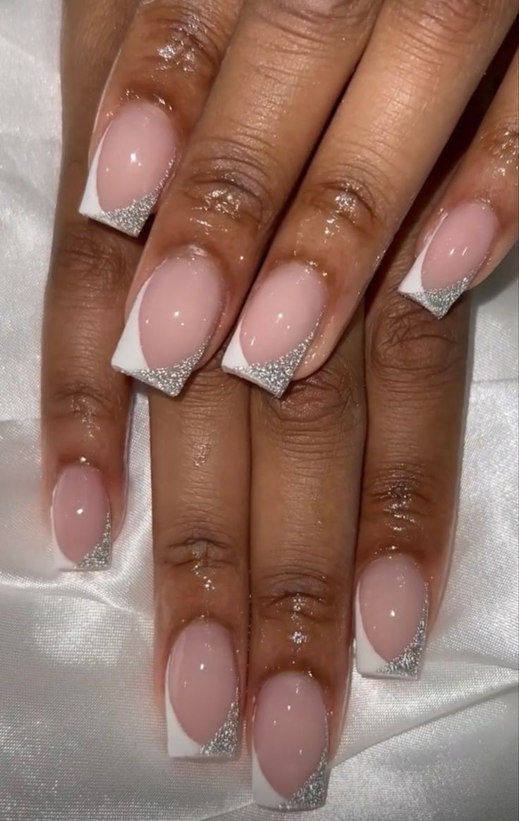 Chic Half-Moon French Manicure with Sparkling Silver Accents.