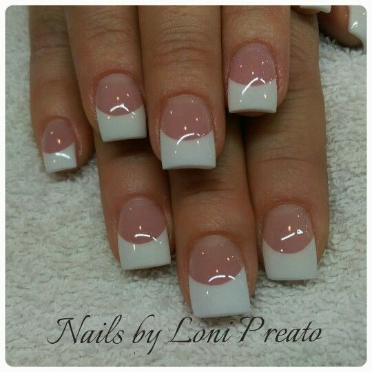 Sophisticated Geometric French Tip Manicure with Soft Pink Base and Modern Cutout Design.