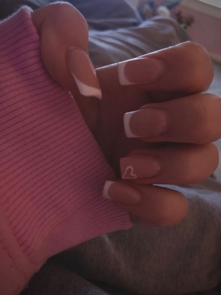 Timeless French Tip Nails with Charming Heart Accent